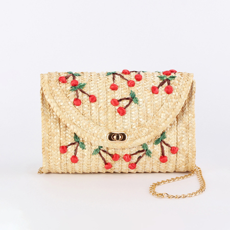 Sac carré femme en paille tressée couleur cerise, style vacances