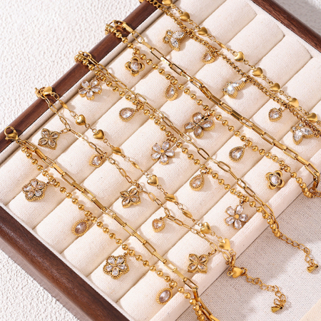 Bracelet à breloques pour femme en acier inoxydable, orné de fleurs, de cœurs et de papillons, étanche, avec zircon doré