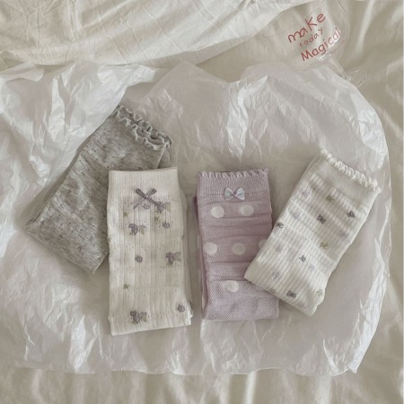 Chaussettes mi-mollet à pois élégants et rebondissants