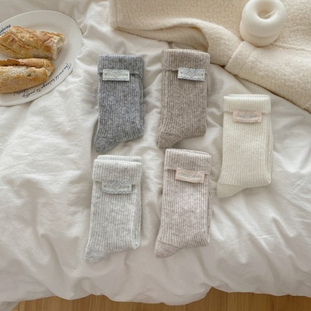 Chaussettes élégantes unies mi-mollet