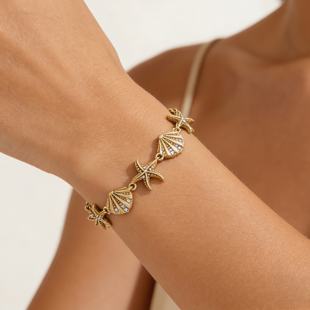 Bracelet à maillons pour femme, style océanique, en acier inoxydable, étanche, couleur or, orné de cristaux.