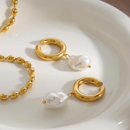 1 paire de manchettes d'oreilles élégantes et irrégulières rondes en acier inoxydable étanche couleur or de la série classique pour femmes