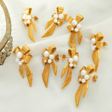 1 paire de boucles d'oreilles puces rétro classiques en acier inoxydable plaqué or avec nœud papillon et perles artificielles pour femme