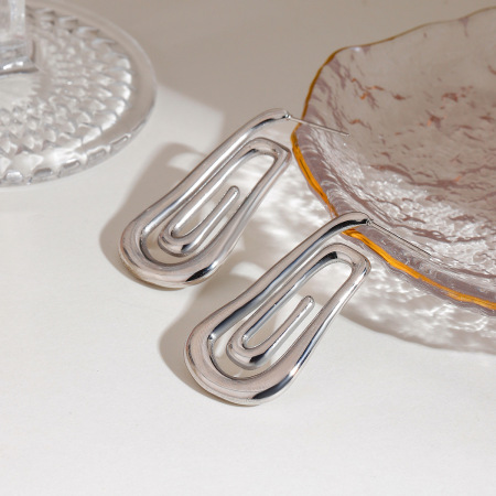 Boucles d'oreilles puces pour femme, style rétro chic minimaliste, en forme de spirale, en acier inoxydable étanche, couleur or (1 paire).
