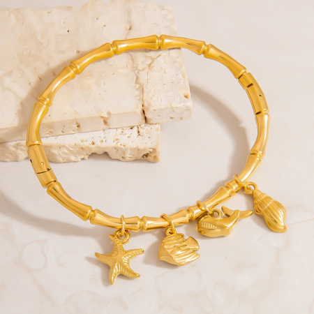 Bracelet à breloques pour femme, élégant, en acier inoxydable, couleur or, avec motif d'organisme marin (1 pièce).