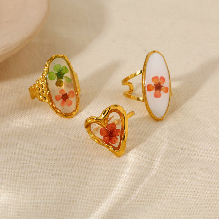 1 paire de bagues élégantes romantiques en acier inoxydable doré, étanches, à motif floral.