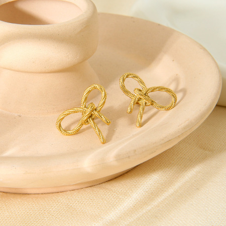 Boucles d'oreilles puces élégantes en acier inoxydable imperméables, style romantique, avec nœud papillon.