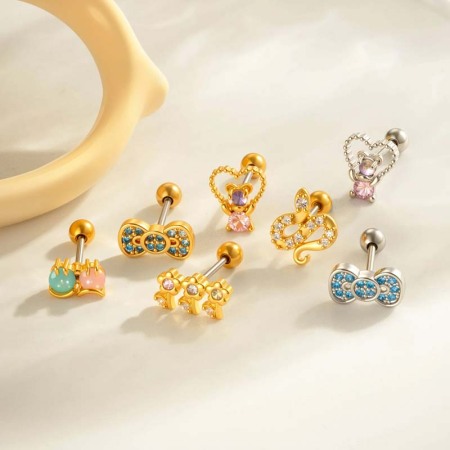 Boucle d'oreille piercing en forme de nœud en cuivre doré et zircon