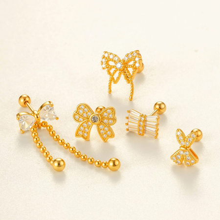 Boucle d'oreille piercing en forme de nœud papillon en cuivre doré et zircon
