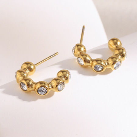 1 paire de boucles d'oreilles créoles simples et élégantes en acier inoxydable imperméable de forme irrégulière pour femme.