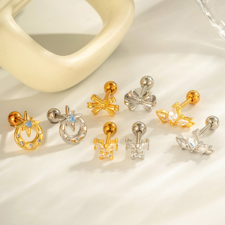 Boucle d'oreille piercing en forme de nœud papillon en cuivre doré et zircon