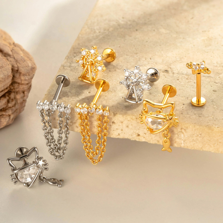 Boucle d'oreille piercing en forme de nœud papillon en cuivre doré et zircon