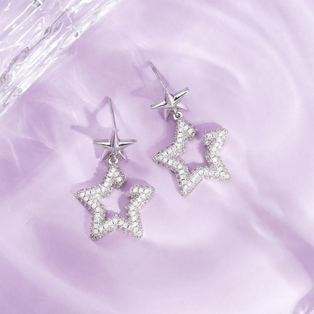 1 paire de boucles d'oreilles festives en cuivre avec étoiles