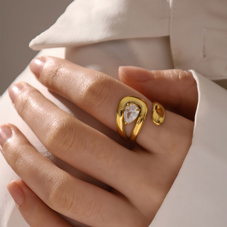 Bague pour femme en acier inoxydable doré, forme simple et irrégulière, étanche, ornée d'une pierre précieuse.