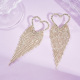 Boucles d'oreilles à pompon en forme de cœur en or et aiguille en argent 