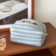 Sac coussin bleu rayé en agneau 
