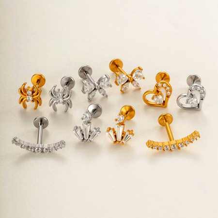 Boucles d'oreilles piercing pour femme, en acier inoxydable doré, ornées d'un nœud papillon et d'un serpent, avec zircon et motif cœur délicat.