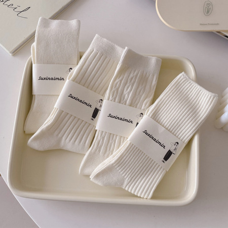 1 paire de chaussettes mi-mollet simples en pur coton texturé de couleur unie pour femmes