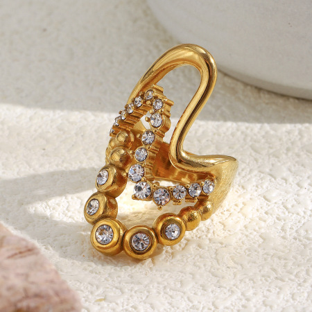 Bague pour femme en acier inoxydable étanche, ornée d'une pierre précieuse et ornée d'un motif vague luxueux et léger.