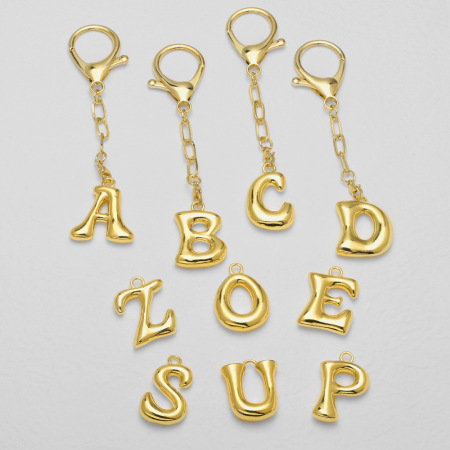 1 porte-clés lettre bulle couleur cuivre doré 2