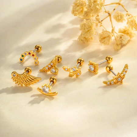 Boucles d'oreilles pendantes délicates en forme d'ailes d'étoile, couleur cuivre doré, avec zircon.