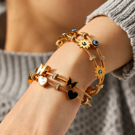 Bracelet jonc étanche en acier inoxydable doré avec œil du diable et papillon (1 pièce)