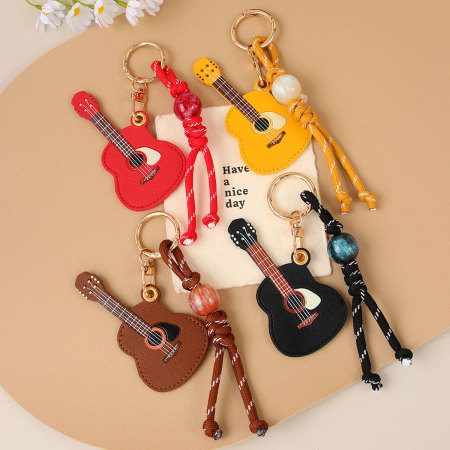 1 mini porte-clés guitare créatif en PU pour femme