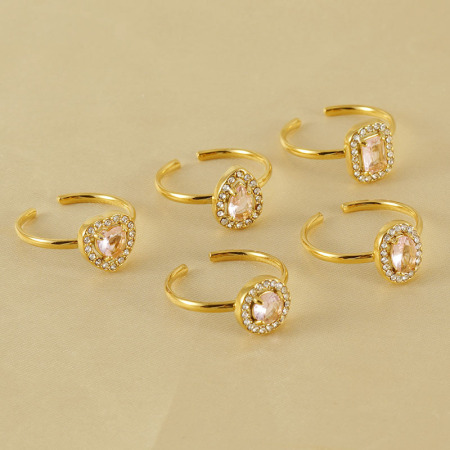 Bague pour femme en acier inoxydable doré, ornée d'un zircon et d'un pendentif goutte d'eau brillant.