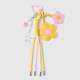 Un porte-clés en forme de fleur jaune