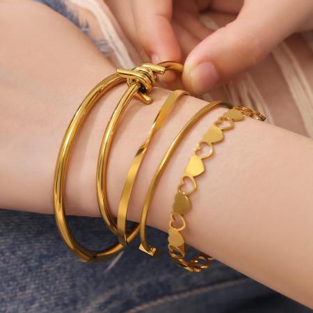 Bracelets manchettes élégants pour femmes, en acier inoxydable, imperméables et anti-ternissement, couleur or, de forme irrégulière.