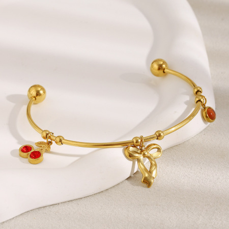 Bracelet manchette en acier inoxydable étanche couleur or avec nœud papillon