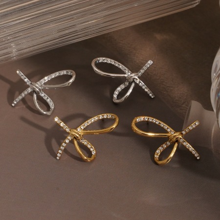 Boucles d'oreilles puces élégantes pour femmes, en acier inoxydable imperméable, couleur or, avec nœud papillon et zircon.