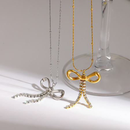 Colliers pendentifs pour femmes en acier inoxydable imperméable, ornés d'un nœud papillon romantique et de zircon couleur or.