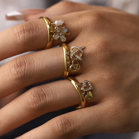 Bagues tendance en acier inoxydable doré, imperméables, ornées de strass et de fleurs en forme de cœur.