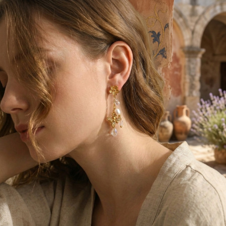 Boucles d'oreilles pendantes pour femme, style ailes de fleur, en acier inoxydable étanche, couleur or.