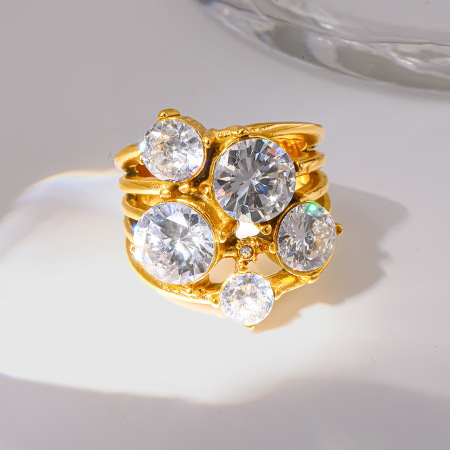 Bagues élégantes et luxueuses en acier inoxydable doré, de forme irrégulière et serties de zircon, avec embout rond et forme irrégulière. Elles sont imperméables et ornées de zircon.