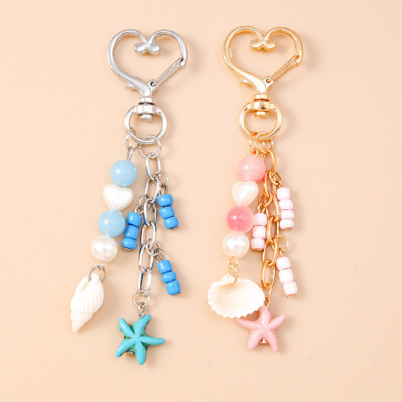 Collection romantique de bijoux de sac style océanique en perles, coquillage et étoile de mer, en alliage