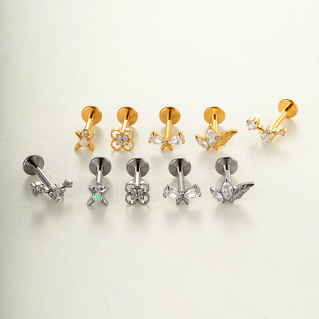 Boucles d'oreilles piercing femme en alliage de titane doré avec nœud papillon et zircon.