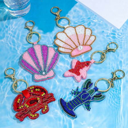 Porte-clés en métal avec perles style océanien