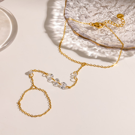 Chaîne de poignet élégante et luxueuse en acier inoxydable, couleur or, ornée de zircon et de perles.