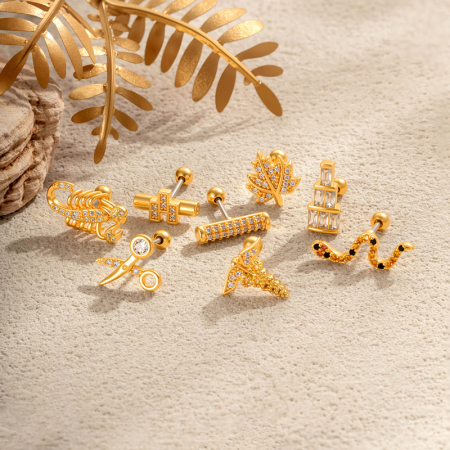Boucles d'oreilles piercing femme en forme de serpent à feuille simple, couleur cuivre doré et zircon.