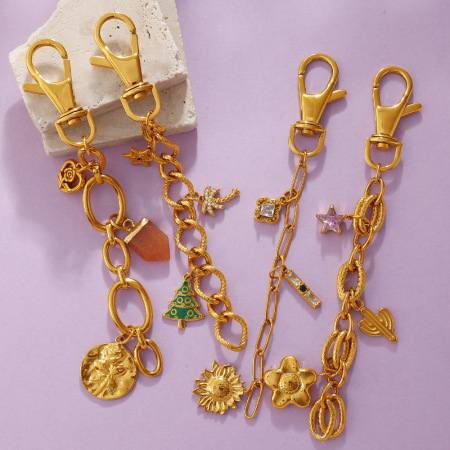 Porte-clés en acier inoxydable doré avec zircon et fleur en forme d'étoile 2