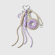 Un porte-clés en forme de sac à beignet violet Image3