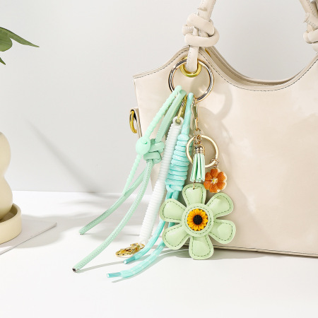 Breloques pour sac en PU à pompon torsadé et à fleurs douces, de couleur assortie, de la série Simple