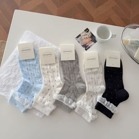 Chaussettes mi-mollet à pois élégants et légèrement rebondissants