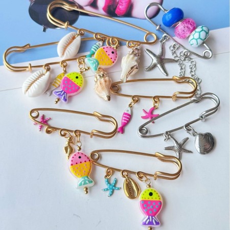 Broches en acier inoxydable couleur or représentant des poissons et des étoiles de mer en vacances