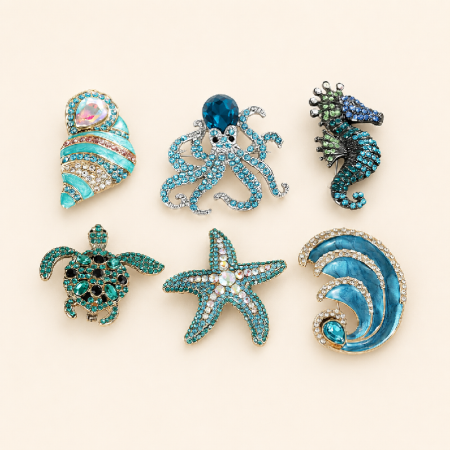 Broches luxueuses en alliage et strass, de forme irrégulière et inspirées de l'océan, représentant des coquillages, des étoiles de mer et des animaux.