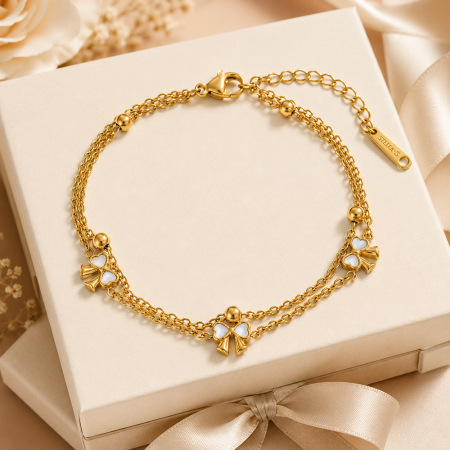 Bracelet chaîne femme en acier inoxydable étanche couleur or avec nœud papillon. 2