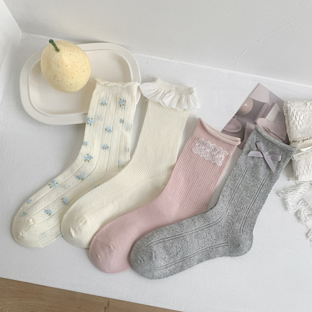 Chaussettes mi-mollet élégantes à petits motifs floraux, légèrement rebondissantes