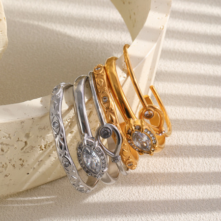 Bracelet manchette pour femme en acier inoxydable doré, étanche, de forme elliptique et orné de zircon, collection Luxueuse.